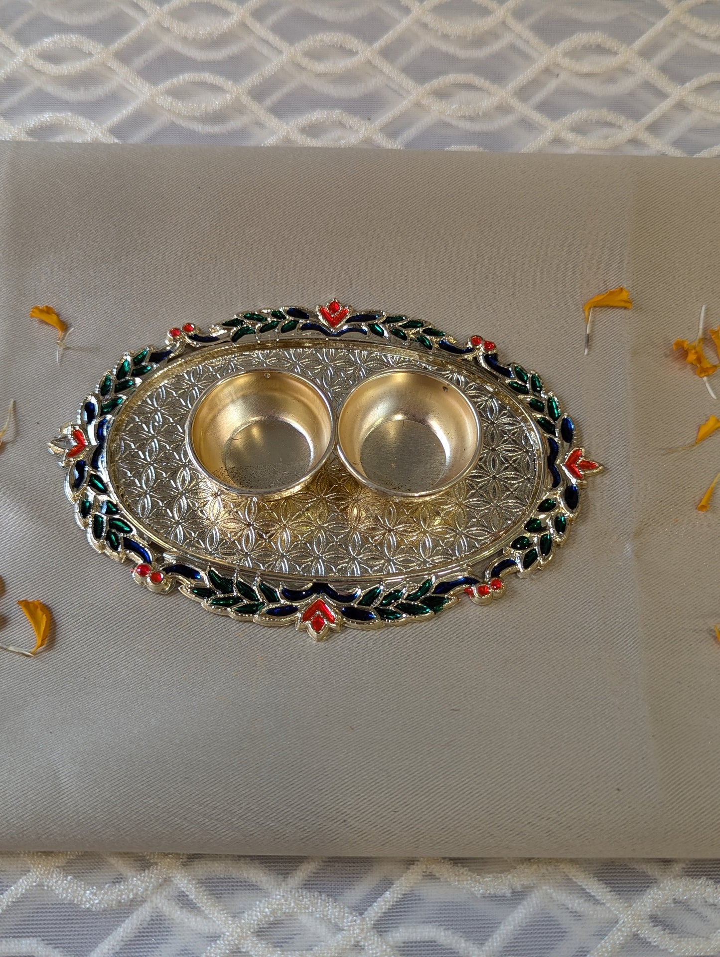 Roli Chawal Cum Rangoli in Oval Shape with Small Flower